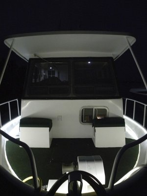 Bow seating area holds two storage lockers, one containing hot water tank, other contains lines. All around lighting allows you to get back from an evening dinghy ride