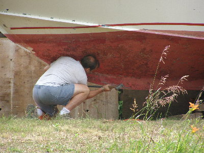 At some point in a previous life, Limitless was either supported incorrectly or the ground softened and she shifted causing a roll in the keel. We cut open the keel, pried and pounded her back true. Welded some reinforcing back into the leading edge.